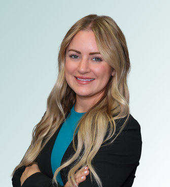 woman smiling, wearing a suit