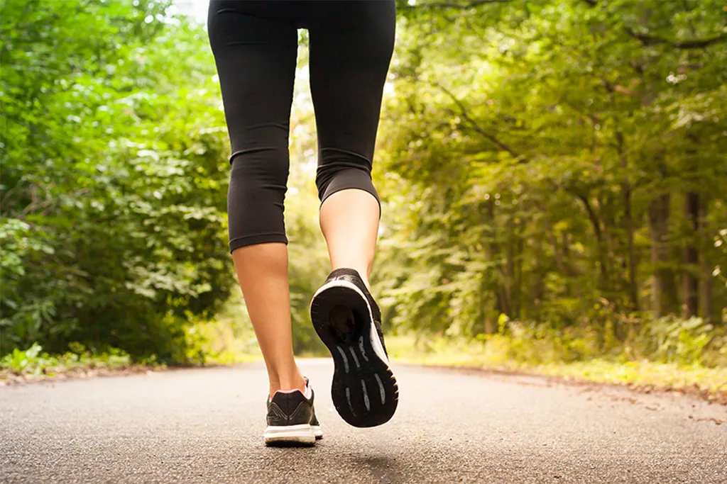 person running in the woods with heel pain