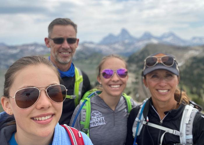 A family of four on a hike