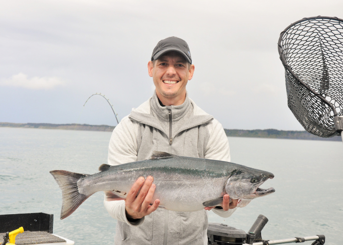 Dr. Hartman holding a fish