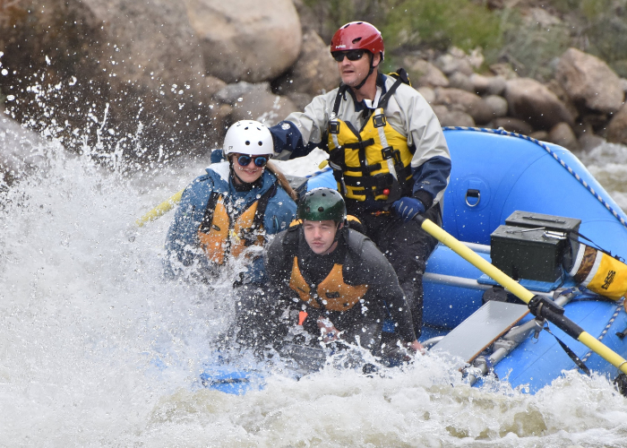 A group of people white river rafting