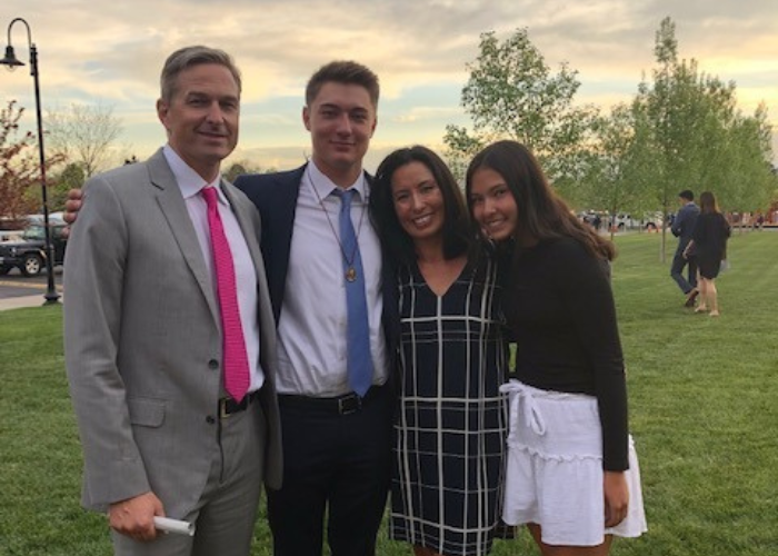 A family of 4 posing 