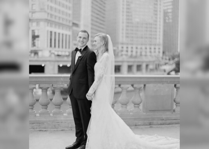 Dr. Johnson stands with his wife after their wedding. The picture is in black and white.